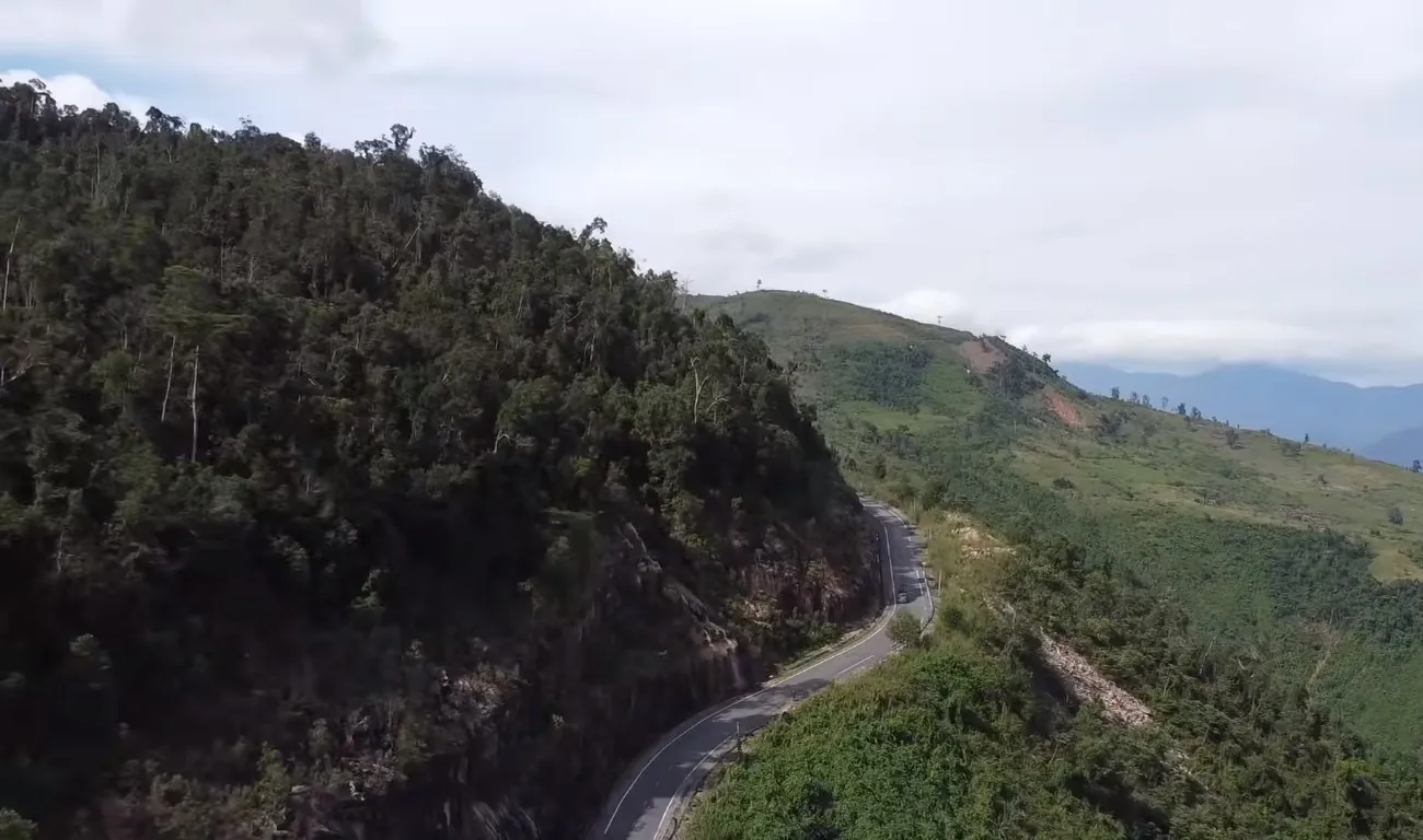 A motorbike road winding up a mountain pass in the highlands near Dalat